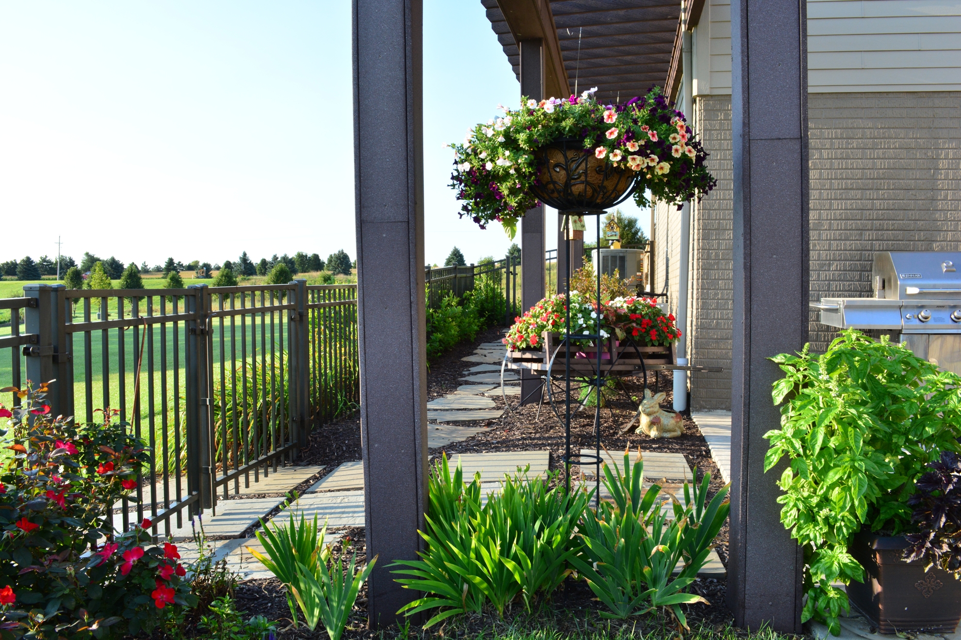 Baskets hang from the custom Pergola.